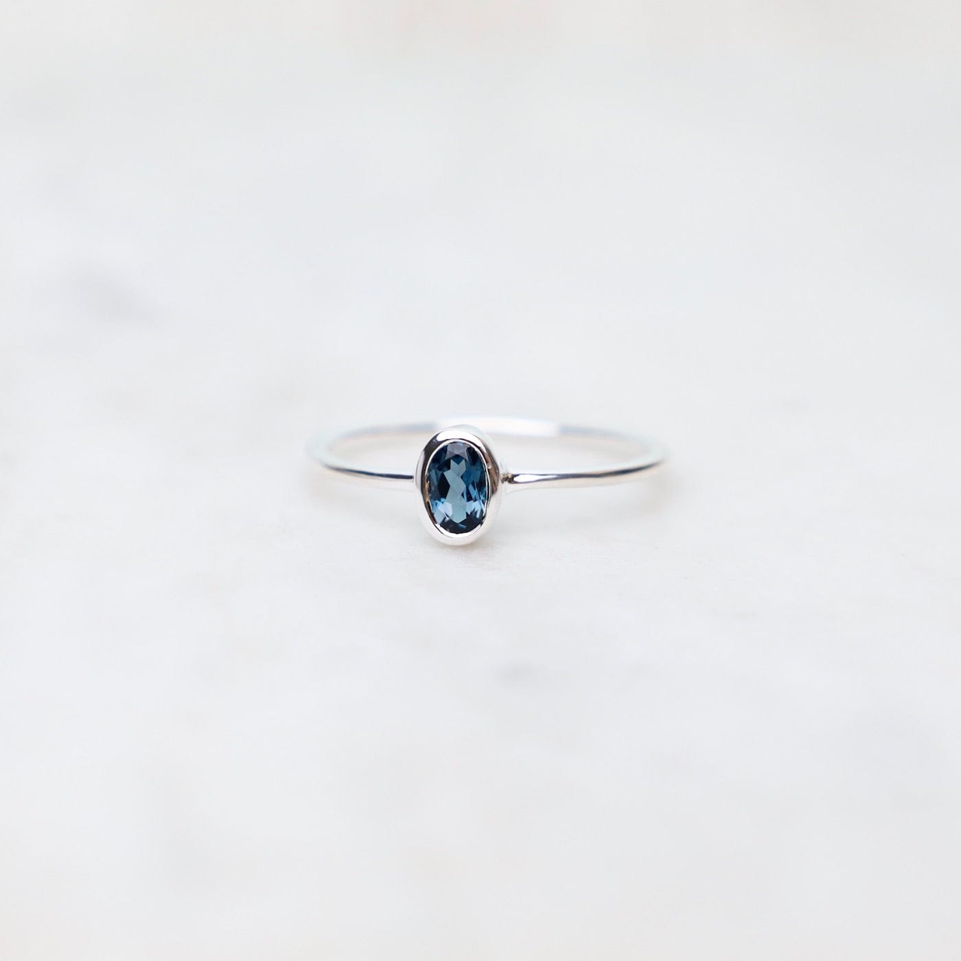 RNG Sterling Silver Oval Bezel Set London Blue Topaz Ring