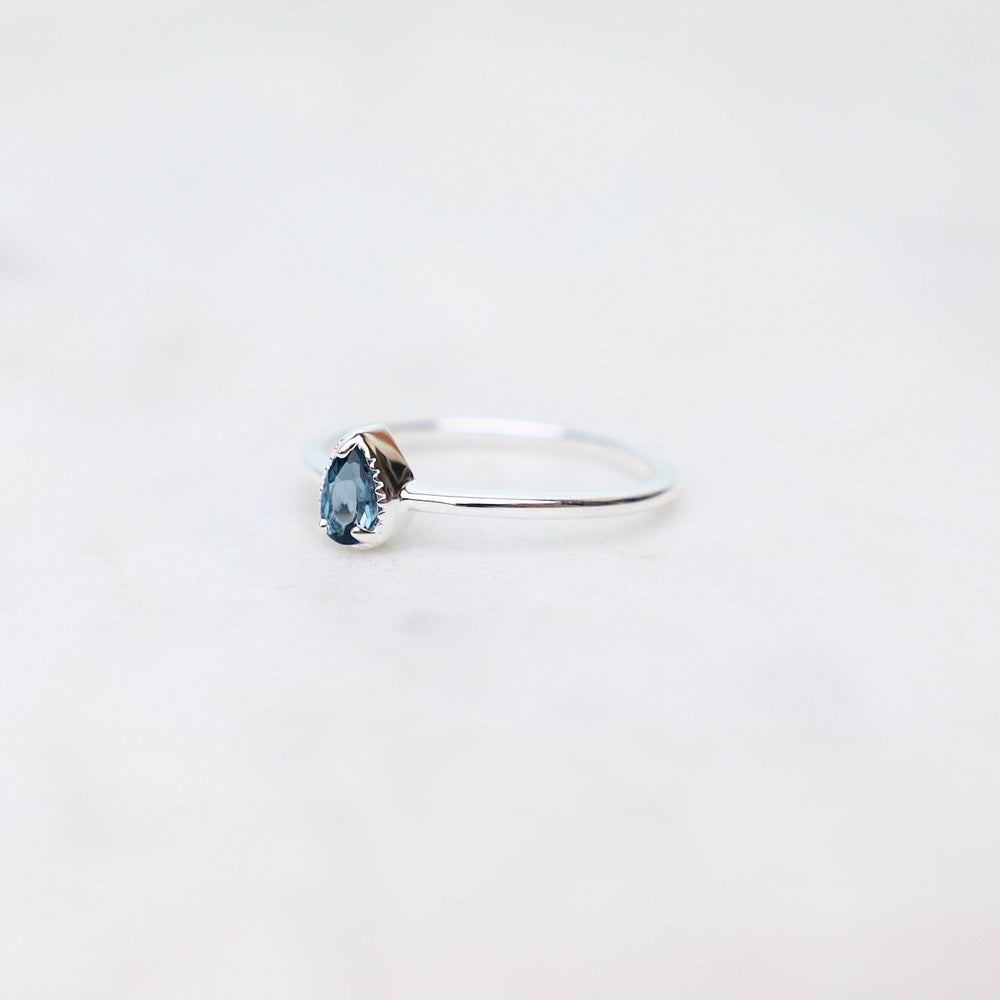 
                      
                        RNG Sterling Silver Pear Cut London Blue Topaz Milgrain Edge Ring
                      
                    