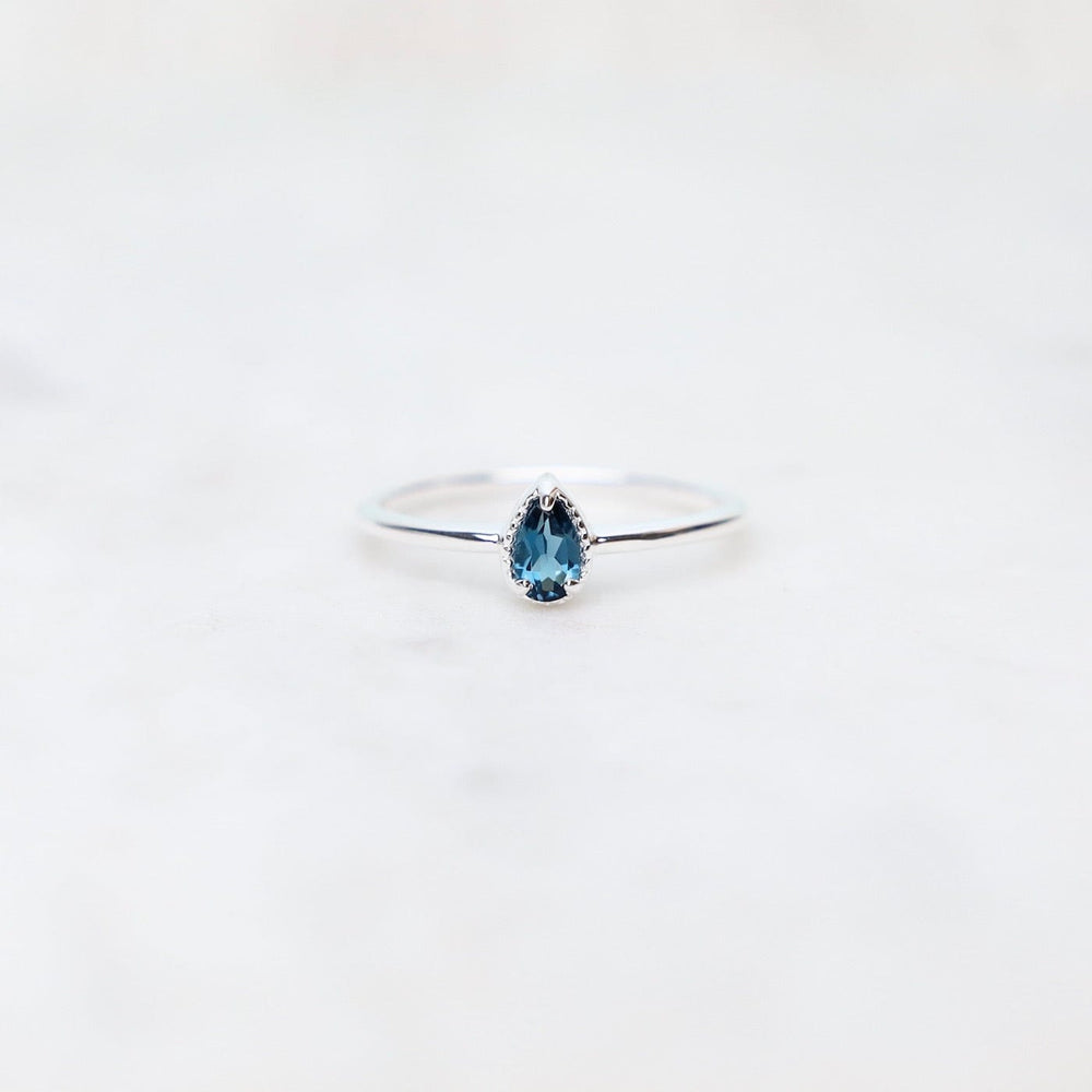 
                      
                        RNG Sterling Silver Pear Cut London Blue Topaz Milgrain Edge Ring
                      
                    