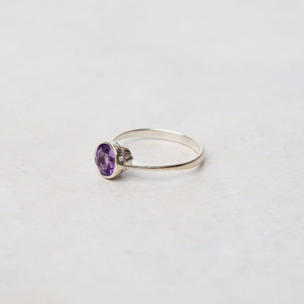 
                      
                        RNG Sterling Silver Ring with 6mm Round Bezel Set Amethyst
                      
                    