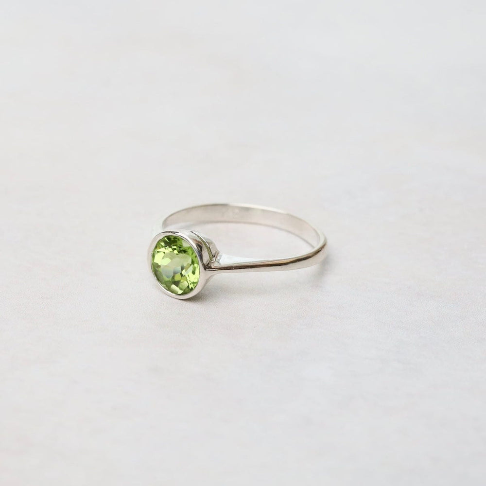 
                  
                    RNG Sterling Silver Ring with 6mm Round Bezel Set Peridot
                  
                