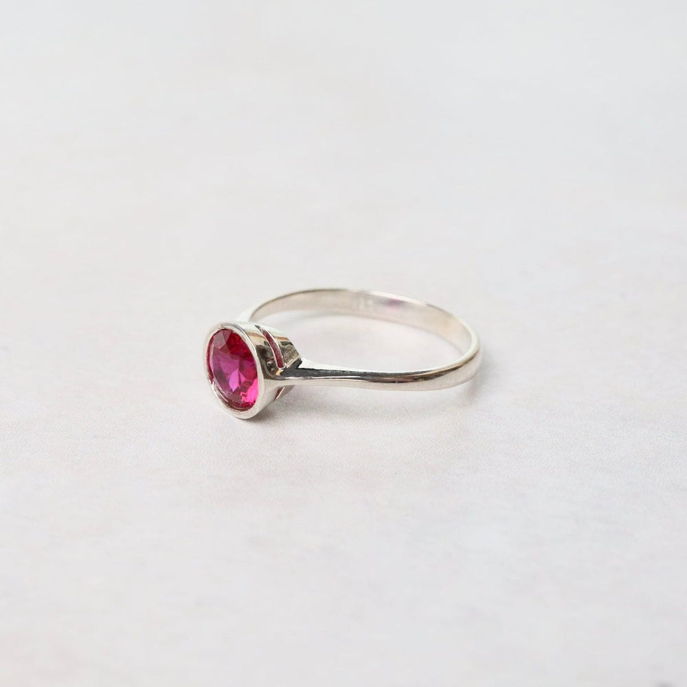 
                  
                    RNG Sterling Silver Ring with 6mm Round Bezel Set Synthetic Ruby
                  
                