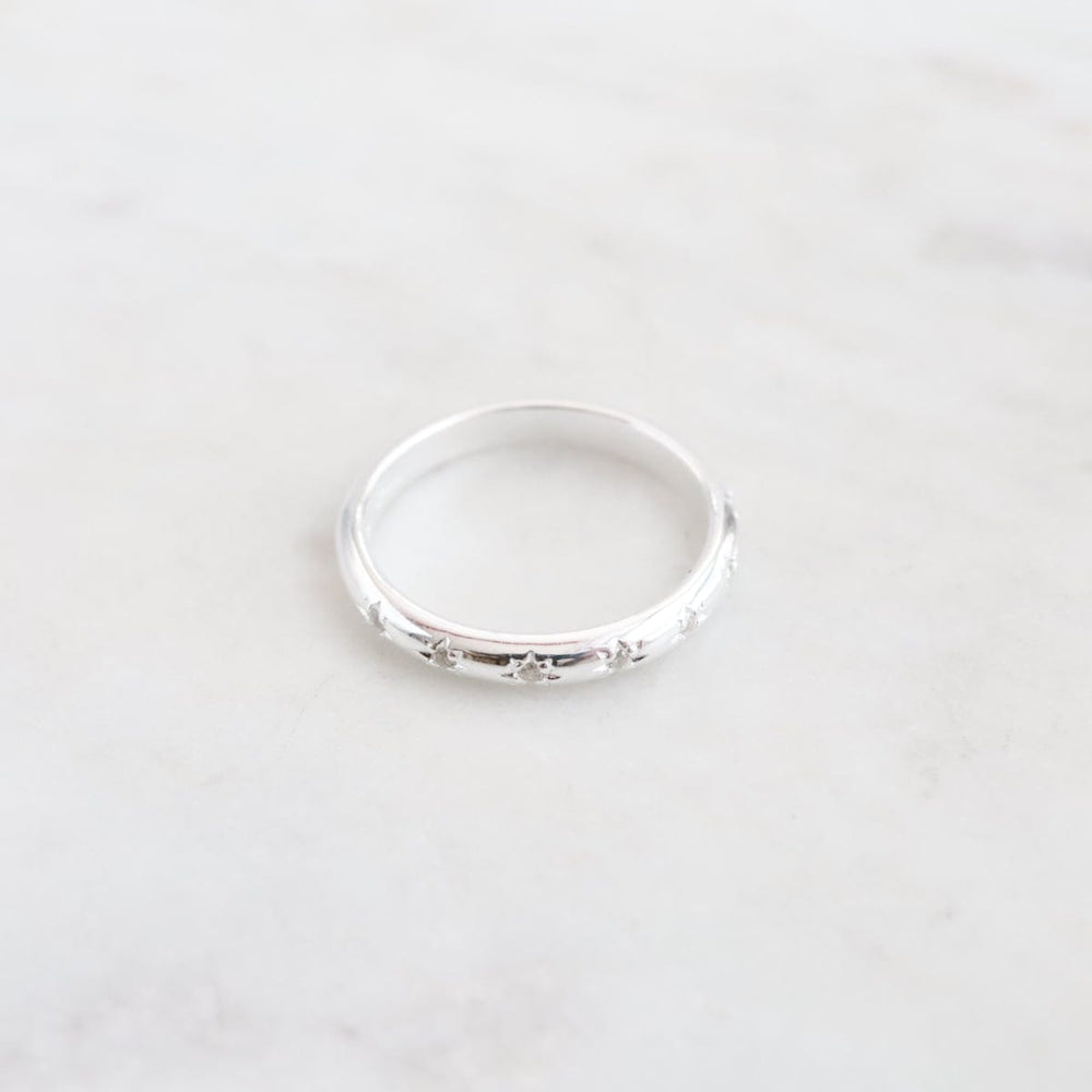 
                      
                        RNG Sterling Silver Slim Band with 7 Star Set CZ Ring
                      
                    