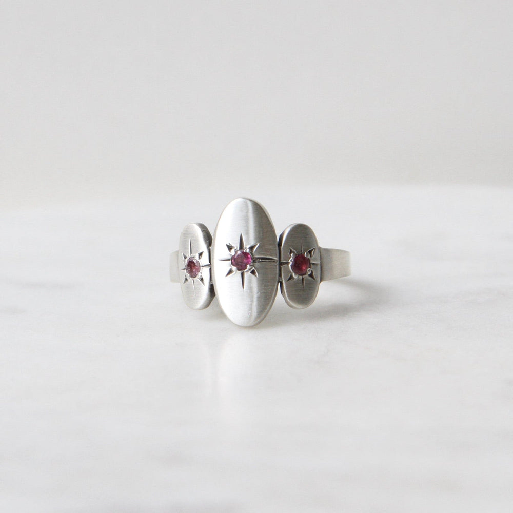 
                      
                        RNG Three Ovals with Star Set Red Garnet Ring
                      
                    