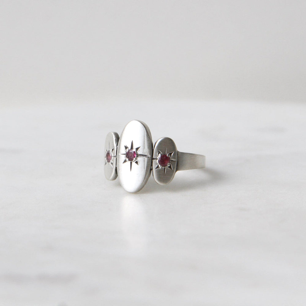 
                      
                        RNG Three Ovals with Star Set Red Garnet Ring
                      
                    