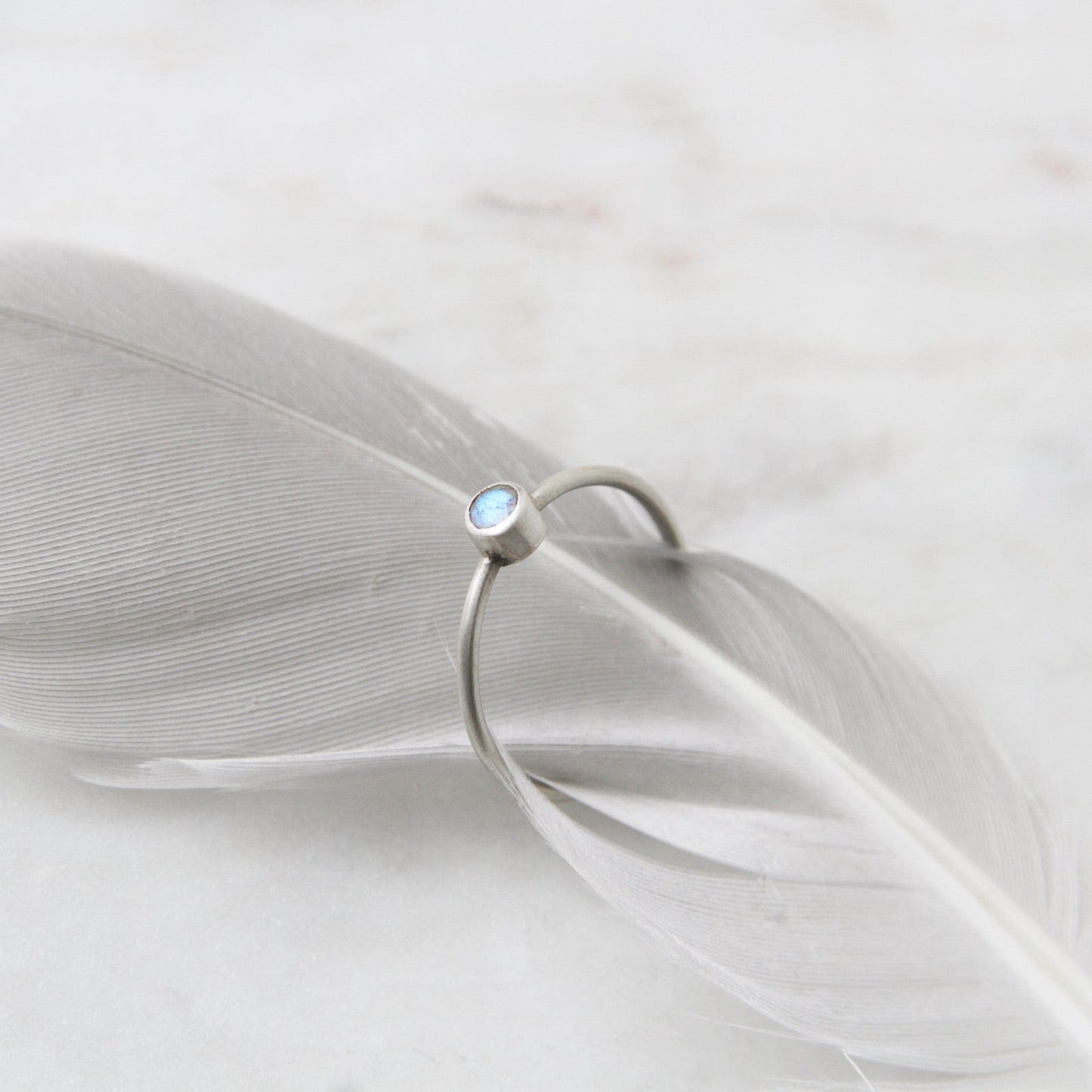 RNG Tiny Faceted Single Rainbow Moonstone in Sterling Ring