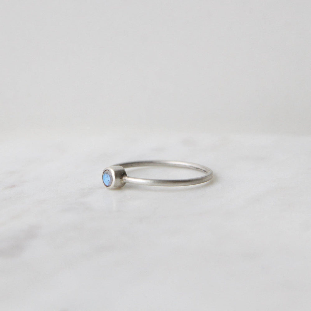 
                      
                        RNG Tiny Faceted Single Rainbow Moonstone in Sterling Ring
                      
                    