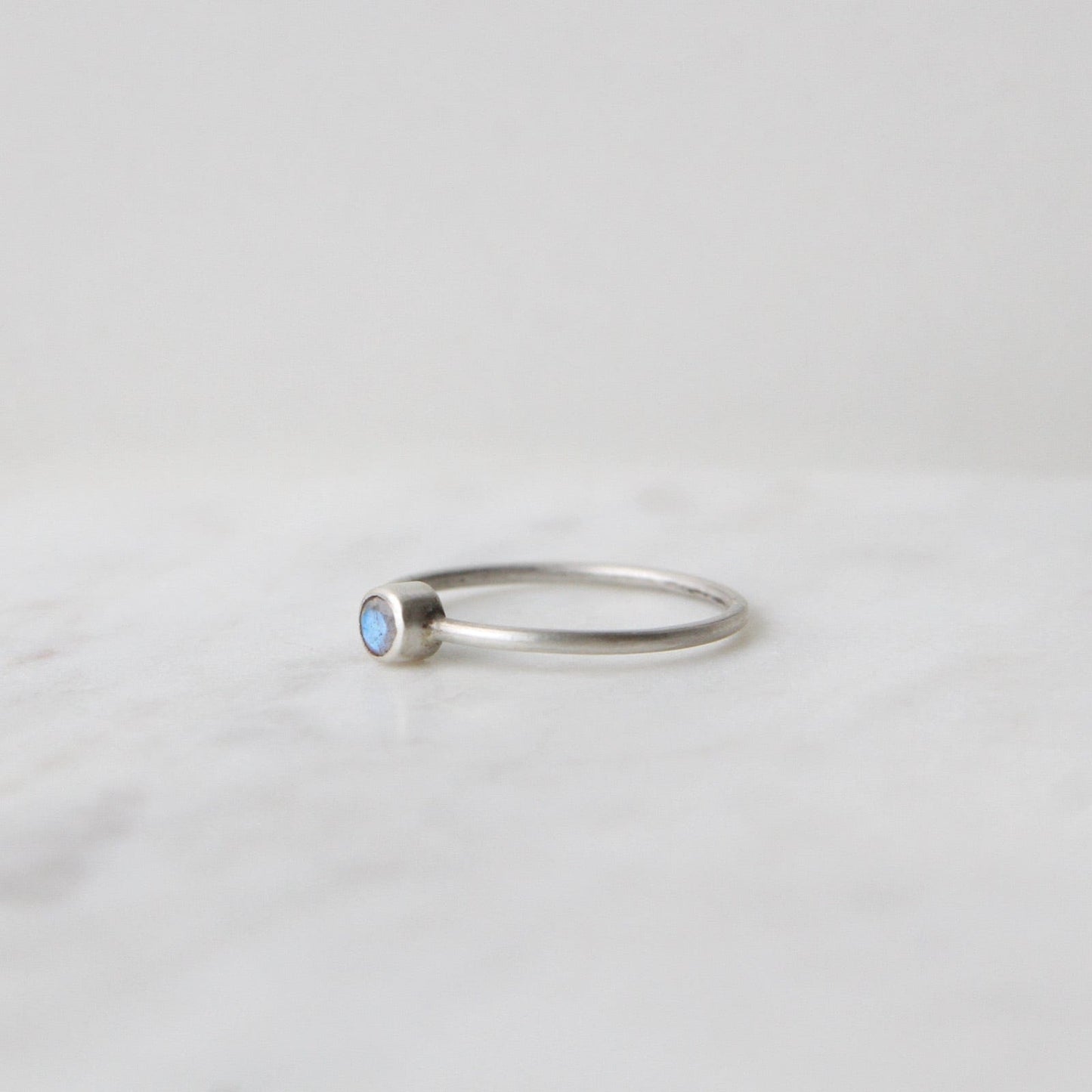 RNG Tiny Faceted Single Rainbow Moonstone in Sterling Ring
