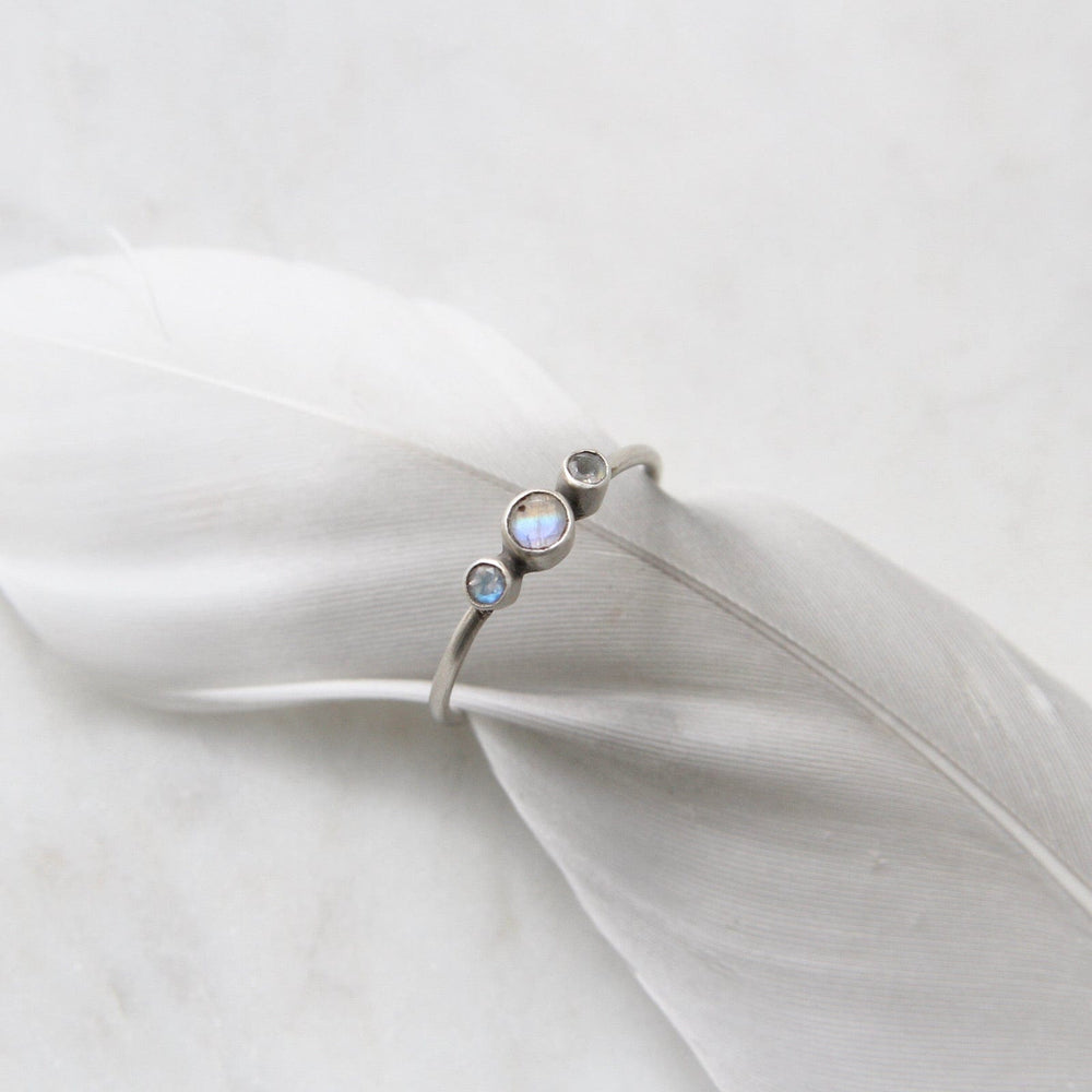 
                      
                        RNG Tiny Graduated Three Rainbow Moonstone in Sterling
                      
                    