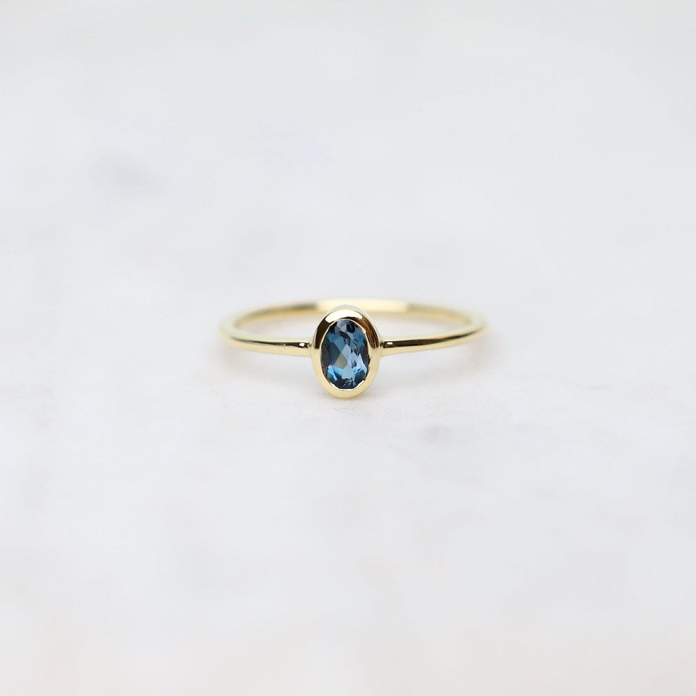 
                      
                        RNG-VERM Gold Vermeil Oval Bezel Set London Blue Topaz Ring
                      
                    