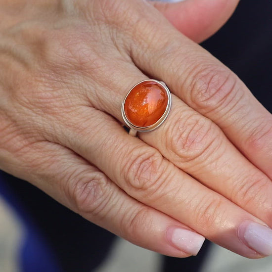 Load and play video in Gallery viewer, Sterling Silver &amp;amp; 14k Gold Ring with Small Oval Smooth Spessartite
